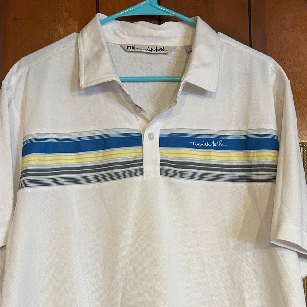 Travis Mathew White Polo with Blue and Yellow Accents